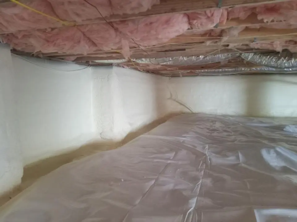 Crawl space encapsulation with closed-cell spray foam for Commercial Roof Restoration in Greenville